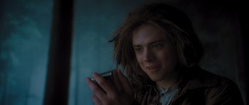 Movie still from “Percy Jackson: Sea of Monsters” (2013), directed by Thor Freudenthal – A man with dread locks is holding a cell phone; Close Up shot, Low angle
