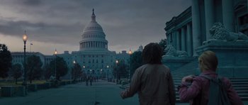 Movie still from “Percy Jackson: Sea of Monsters” (2013), directed by Thor Freudenthal – A person standing in front of a building at night; Wide shot, Low angle