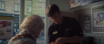 Movie still from “Percy Jackson: Sea of Monsters” (2013), directed by Thor Freudenthal – A man in a black shirt is talking to an older man; Close Up shot, Over the shoulder angle