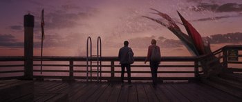Movie still from “Percy Jackson: Sea of Monsters” (2013), directed by Thor Freudenthal – Two people standing on a pier looking at the water; Wide shot, Over the shoulder angle