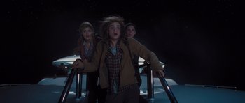 Movie still from “Percy Jackson: Sea of Monsters” (2013), directed by Thor Freudenthal – A group of people that are standing in the dark; Medium shot, Low angle