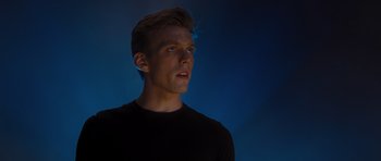 Movie still from “Percy Jackson: Sea of Monsters” (2013), directed by Thor Freudenthal – A young man in a black shirt is looking up; Close Up shot, Low angle