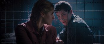 Movie still from “Percy Jackson: Sea of Monsters” (2013), directed by Thor Freudenthal – A woman sitting next to a man in front of a cage; Close Up shot, Over the shoulder angle