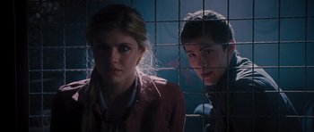 Movie still from “Percy Jackson: Sea of Monsters” (2013), directed by Thor Freudenthal – Two people behind a metal fence looking at the camera; Close Up shot, Low angle