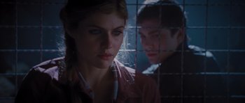 Movie still from “Percy Jackson: Sea of Monsters” (2013), directed by Thor Freudenthal – A woman standing next to a man behind a fence; Close Up shot, Over the shoulder angle