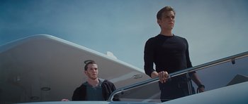 Movie still from “Percy Jackson: Sea of Monsters” (2013), directed by Thor Freudenthal – Two men standing at the top of a flight of stairs; Medium shot, Low angle