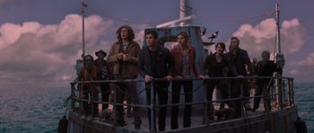 Movie still from “Percy Jackson: Sea of Monsters” (2013), directed by Thor Freudenthal – A group of people standing next to each other on top of a boat; Wide shot, Low angle