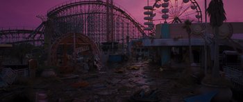 Movie still from “Percy Jackson: Sea of Monsters” (2013), directed by Thor Freudenthal – A abandoned amusement park with a roller coaster in the background; Extreme Wide shot, High angle