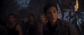Movie still from “Percy Jackson: Sea of Monsters” (2013), directed by Thor Freudenthal – A group of people standing next to each other in the dark; Close Up shot, Over the shoulder angle