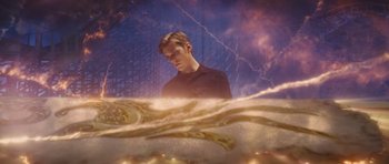 Movie still from “Percy Jackson: Sea of Monsters” (2013), directed by Thor Freudenthal – A man standing in front of an image of a roller coaster; Medium shot, High angle
