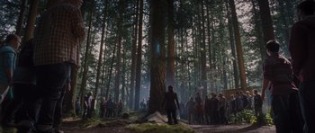 Movie still from “Percy Jackson: Sea of Monsters” (2013), directed by Thor Freudenthal – A group of people standing in front of a large tree; Extreme Wide shot, Low angle