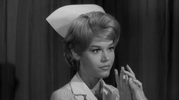 Movie still from “Period of Adjustment” (1962), directed by George Roy Hill – An old photo of a woman in a nurse's uniform; Close Up shot, Low angle