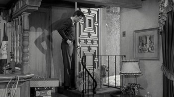 Movie still from “Period of Adjustment” (1962), directed by George Roy Hill – A man standing on the steps of a house; Wide shot, High angle