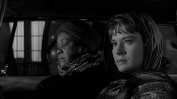 Movie still from “Period of Adjustment” (1962), directed by George Roy Hill – Two people sitting in the back seat of a car; Close Up shot, Low angle