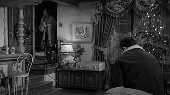 Movie still from “Period of Adjustment” (1962), directed by George Roy Hill – A black - and - white photo of a living room; Wide shot, High angle