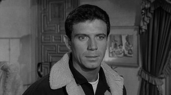 Movie still from “Period of Adjustment” (1962), directed by George Roy Hill – Black and white photograph of a man in a jacket; Close Up shot, Low angle