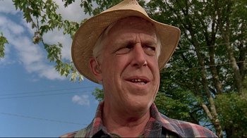 Movie still from “Pet Sematary” (1989), directed by Mary Lambert – An older man wearing a straw cowboy hat; Close Up shot, Low angle