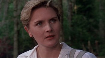 Movie still from “Pet Sematary” (1989), directed by Mary Lambert – A person with short blonde hair; Close Up shot, Over the shoulder angle