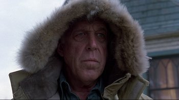 Movie still from “Pet Sematary” (1989), directed by Mary Lambert – A person wearing a coat; Close Up shot, Low angle