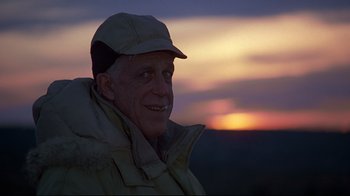 Movie still from “Pet Sematary” (1989), directed by Mary Lambert – An older man wearing a hat and a jacket; Close Up shot, Low angle