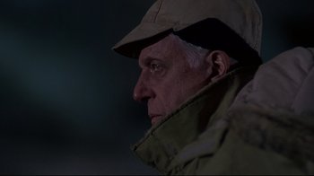 Movie still from “Pet Sematary” (1989), directed by Mary Lambert – An older man wearing a hat and a jacket; Close Up shot, Low angle