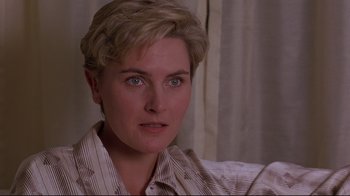 Movie still from “Pet Sematary” (1989), directed by Mary Lambert – A person with short blonde hair; Close Up shot, Over the shoulder angle
