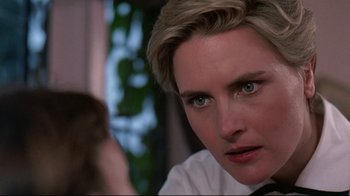 Movie still from “Pet Sematary” (1989), directed by Mary Lambert – A person wearing a shirt and tie; Close Up shot, Over the shoulder angle