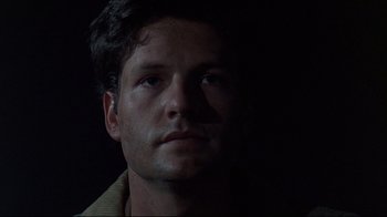 Movie still from “Pet Sematary” (1989), directed by Mary Lambert – A person looking at the camera; Close Up shot, Low angle