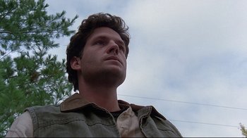 Movie still from “Pet Sematary” (1989), directed by Mary Lambert – A person looking up at the sky; Close Up shot, Low angle