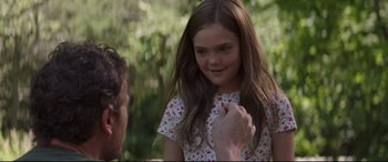 Movie still from “Pet Sematary” (2019), directed by Kevin Kölsch – A young girl with long brown hair is looking at an older man; Close Up shot, Over the shoulder angle