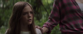 Movie still from “Pet Sematary” (2019), directed by Kevin Kölsch – A young girl being held down by a man; Close Up shot, Low angle