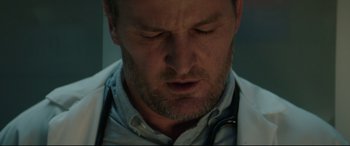 Movie still from “Pet Sematary” (2019), directed by Kevin Kölsch – A person with a stethoscope; Close Up shot, Low angle