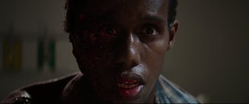 Movie still from “Pet Sematary” (2019), directed by Kevin Kölsch – A person with blood on his face; Close Up shot, Overhead angle