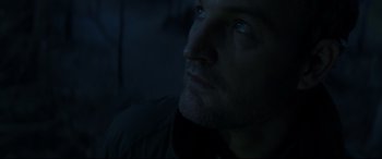 Movie still from “Pet Sematary” (2019), directed by Kevin Kölsch – A man's face in the dark; Close Up shot, Low angle