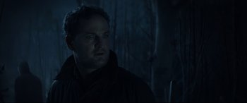 Movie still from “Pet Sematary” (2019), directed by Kevin Kölsch – A person in a dark room; Close Up shot, Low angle