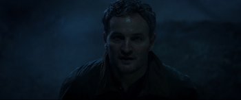 Movie still from “Pet Sematary” (2019), directed by Kevin Kölsch – A person wearing a brown jacket; Close Up shot, Low angle