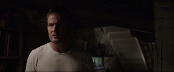 Movie still from “Pet Sematary” (2019), directed by Kevin Kölsch – A person in a dark room; Close Up shot, Over the shoulder angle