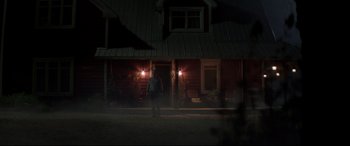 Movie still from “Pet Sematary” (2019), directed by Kevin Kölsch – A man standing in front of a house at night; Extreme Wide shot, Low angle