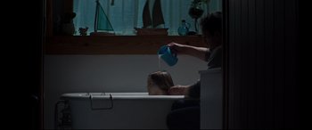 Movie still from “Pet Sematary” (2019), directed by Kevin Kölsch – A man and a child in a bath tub; Medium shot, Over the shoulder angle