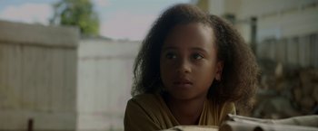 Movie still from “Pete's Dragon” (2016), directed by David Lowery – A person with long curly hair; Close Up shot, Over the shoulder angle