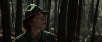 Movie still from “Pete's Dragon” (2016), directed by David Lowery – A woman wearing a hat in the woods; Close Up shot, Low angle