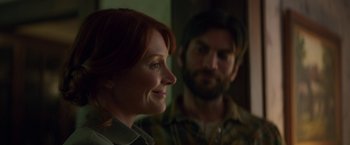 Movie still from “Pete's Dragon” (2016), directed by David Lowery – A woman and a man are looking at the camera; Close Up shot, Over the shoulder angle