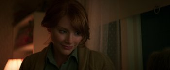 Movie still from “Pete's Dragon” (2016), directed by David Lowery – A person with red hair looking at the camera; Close Up shot, Over the shoulder angle