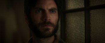 Movie still from “Pete's Dragon” (2016), directed by David Lowery – A person with a beard looking straight ahead; Close Up shot, Low angle