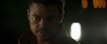 Movie still from “Pete's Dragon” (2016), directed by David Lowery – A man's face in the dark; Close Up shot, Low angle