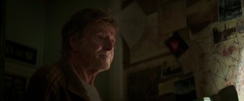 Movie still from “Pete's Dragon” (2016), directed by David Lowery – An old man with a beard is looking into the distance; Close Up shot, Over the shoulder angle