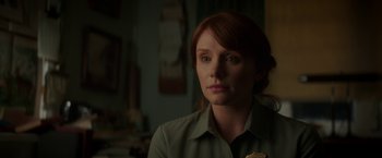Movie still from “Pete's Dragon” (2016), directed by David Lowery – A woman with red hair is looking at the camera; Close Up shot, Over the shoulder angle