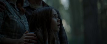Movie still from “Pete's Dragon” (2016), directed by David Lowery – A young girl looking up into the sky; Close Up shot, Low angle