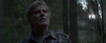Movie still from “Pete's Dragon” (2016), directed by David Lowery – An older man with a beard and a plaid shirt; Close Up shot, Low angle