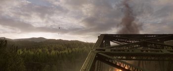 Movie still from “Pete's Dragon” (2016), directed by David Lowery – An airplane is flying over a forest and a bridge; Extreme Wide shot, High angle